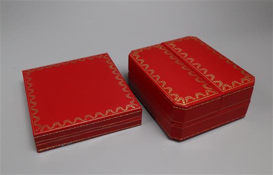 Two Cartier boxes